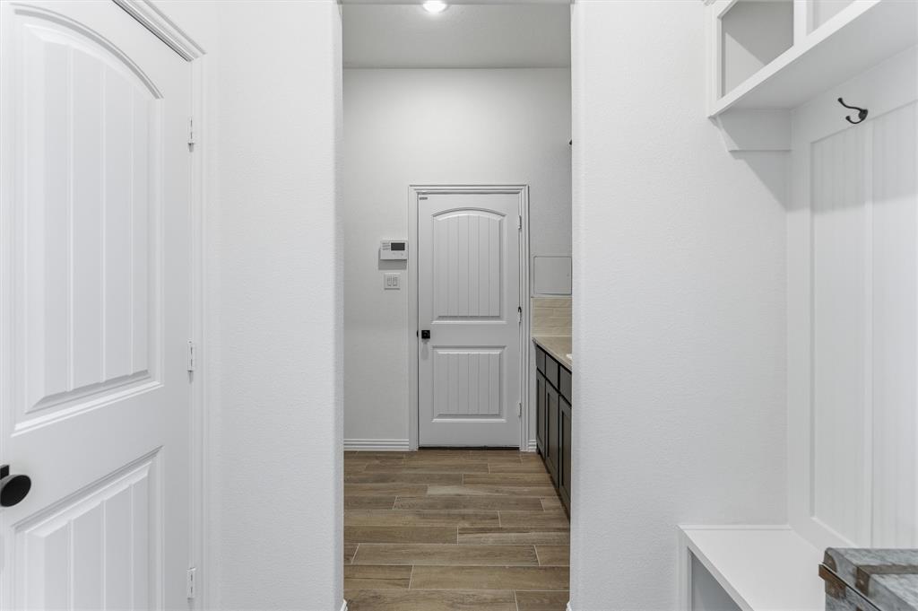 404 Hayden Faith Court Springtown, TX 76082 - Photo 9 of 24 a view of a hallway with closet and a bathroom