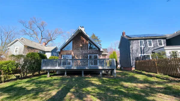 a view of house with yard and entertaining space