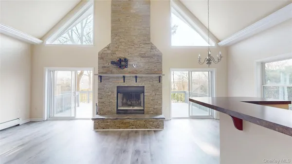a room with fireplace and wooden floor
