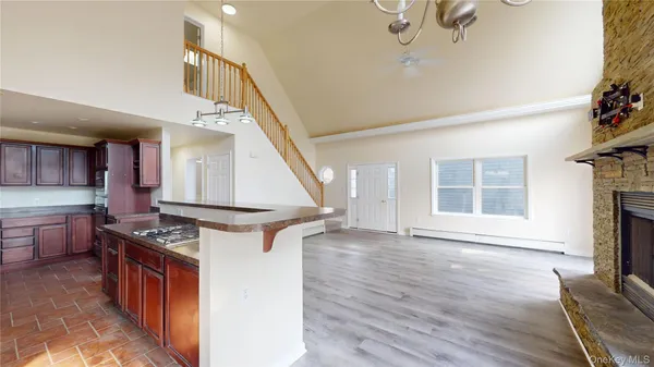 a kitchen with stainless steel appliances granite countertop a stove and a refrigerator
