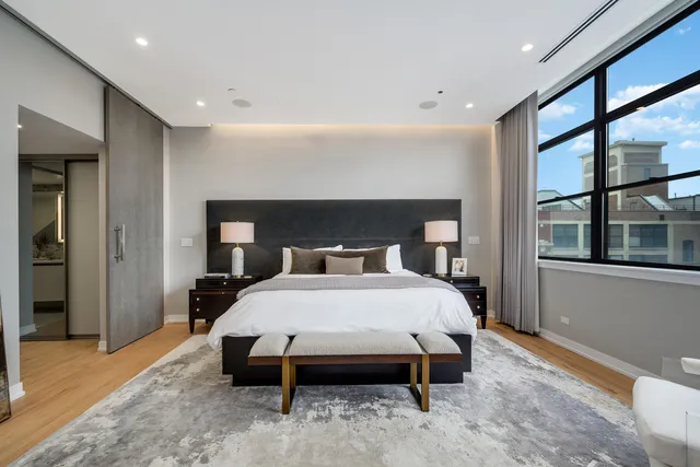 a bed room with a bed and a window