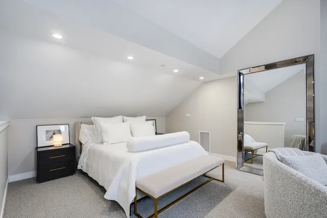 a bed room with a bed and a couch