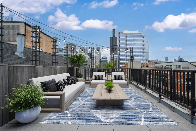 a view of a terrace with couches and potted plants