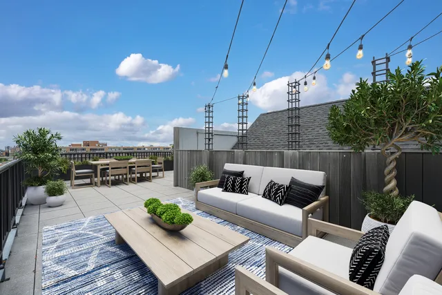 a view of a patio with couches and potted plants