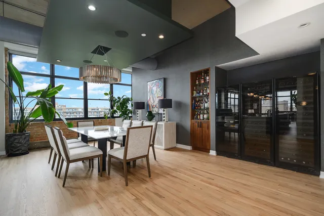 a dining room with furniture and wooden floor