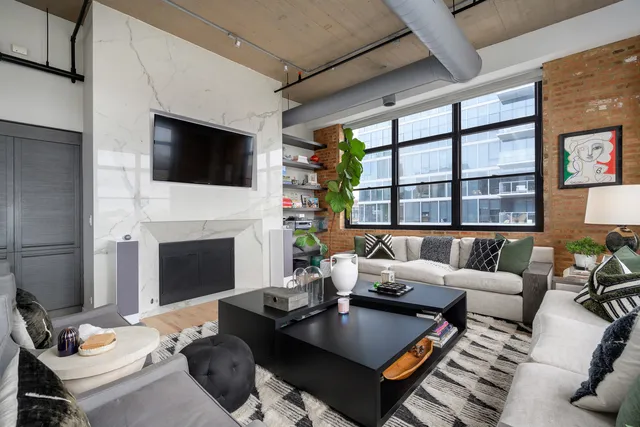 a living room with furniture fireplace and a flat screen tv
