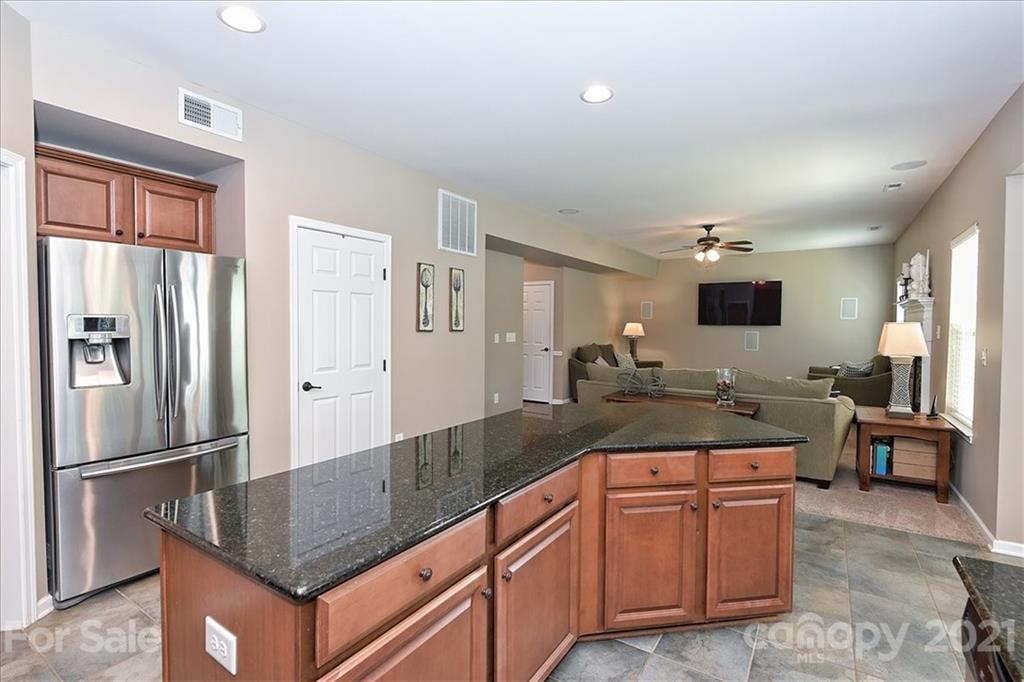 3007 Fallondale Road Waxhaw, NC 28173 - Photo 14 of 46 a kitchen with stainless steel appliances granite countertop a refrigerator and a sink