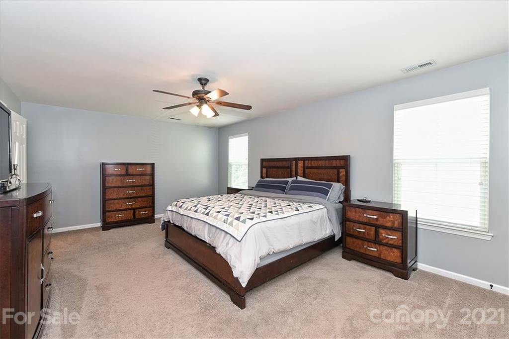 3007 Fallondale Road Waxhaw, NC 28173 - Photo 20 of 46 a bedroom with a bed and a tv
