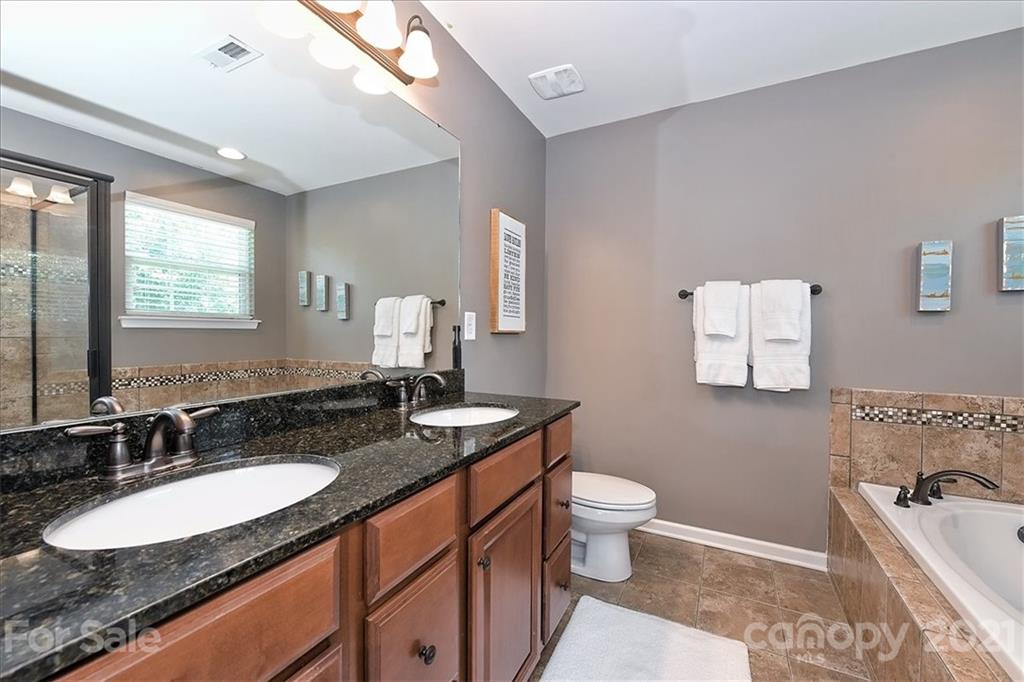3007 Fallondale Road Waxhaw, NC 28173 - Photo 23 of 46 a bathroom with a granite countertop sink and a mirror