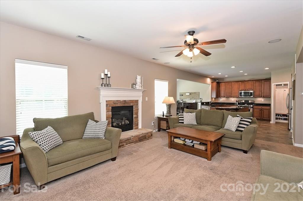 3007 Fallondale Road Waxhaw, NC 28173 - Photo 8 of 46 a living room with furniture and a fireplace