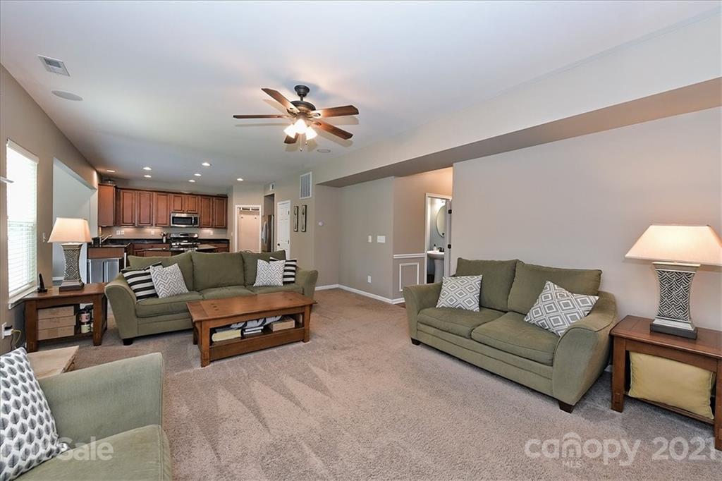 3007 Fallondale Road Waxhaw, NC 28173 - Photo 9 of 46 a living room with furniture kitchen view and a chandelier