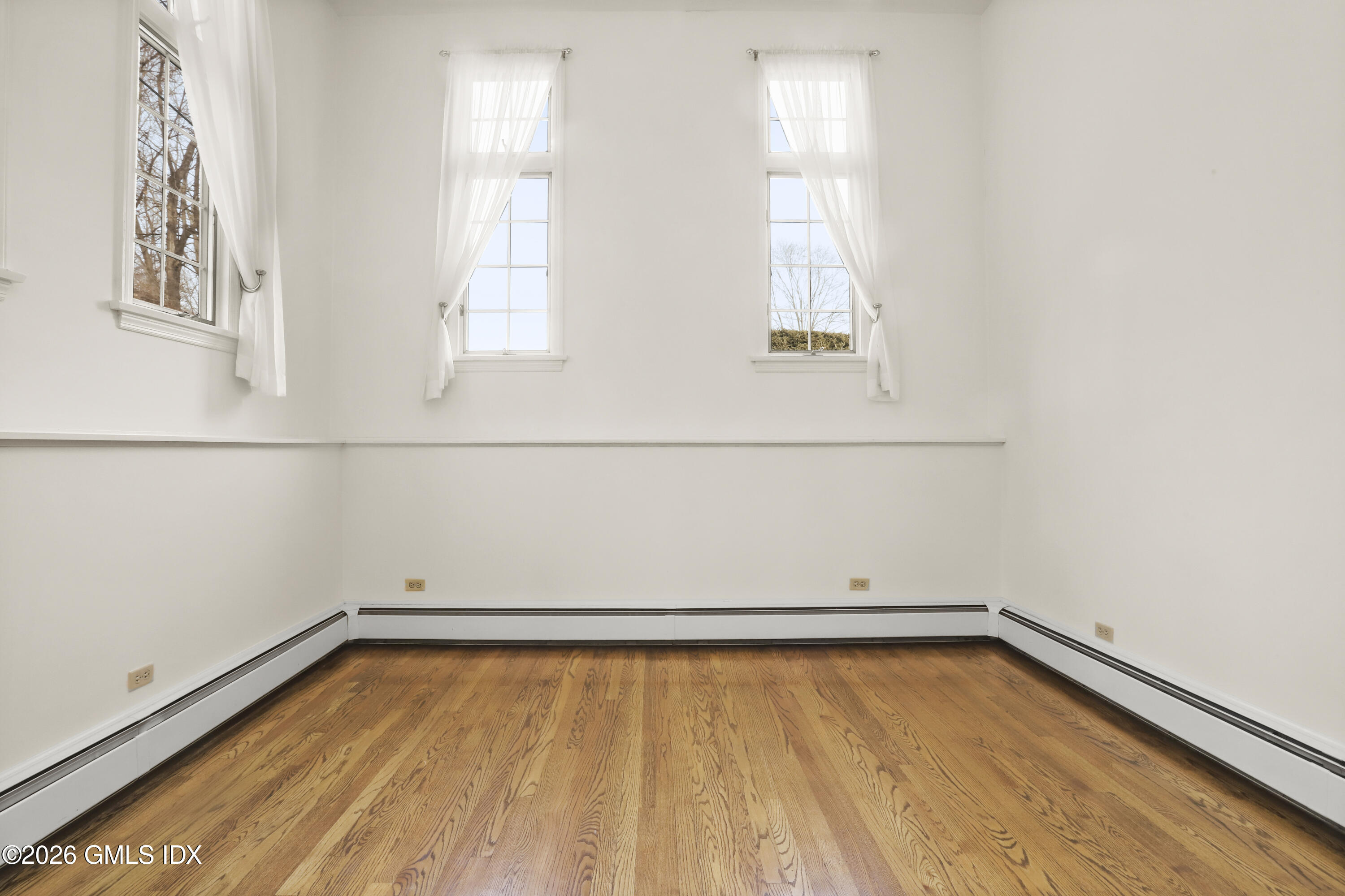 200 Weaver Street, Unit B Greenwich, CT 06831 - Photo 15 of 30 a view of a room with wooden floor and windows