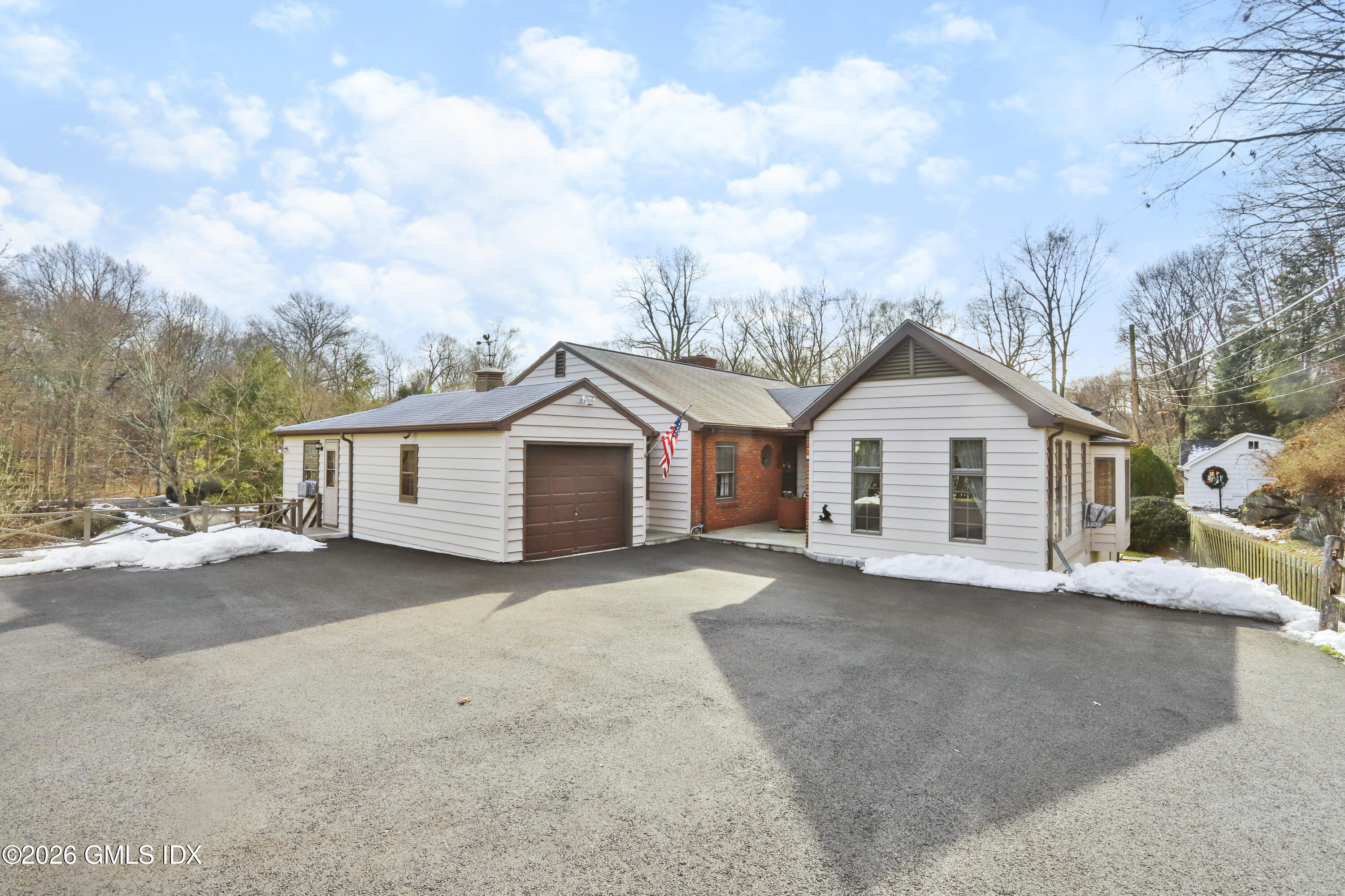 200 Weaver Street, Unit B Greenwich, CT 06831 - Photo 2 of 30 a view of a house with a yard