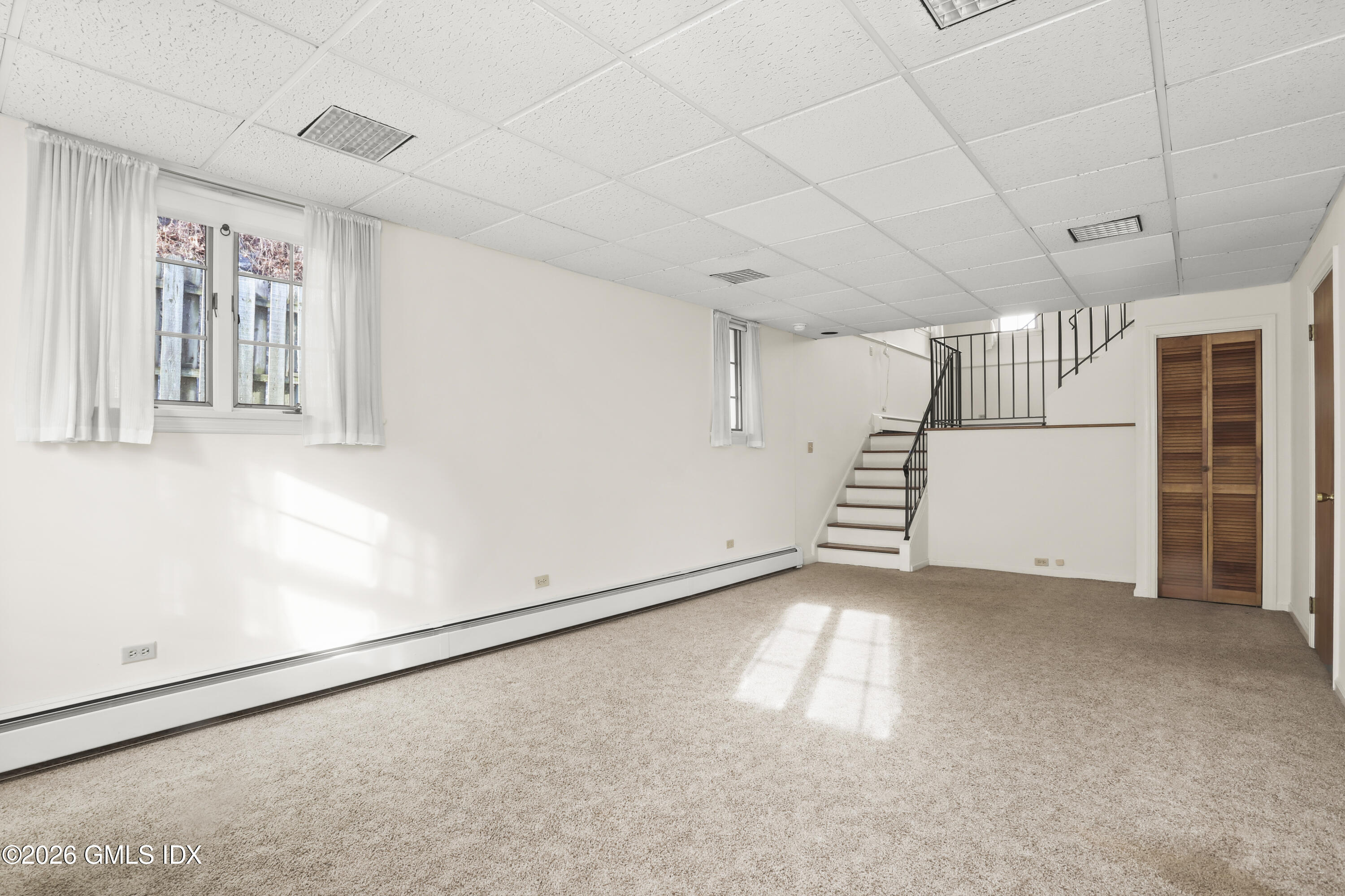 200 Weaver Street, Unit B Greenwich, CT 06831 - Photo 21 of 30 a view of empty room with stairs and a window