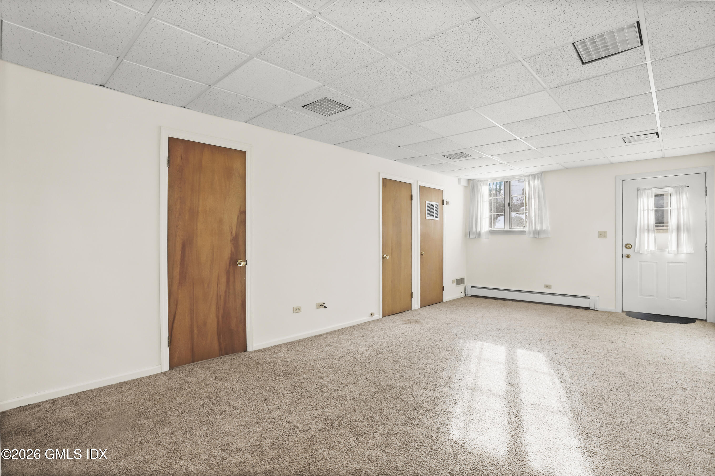 200 Weaver Street, Unit B Greenwich, CT 06831 - Photo 23 of 30 a view of an empty room with a window