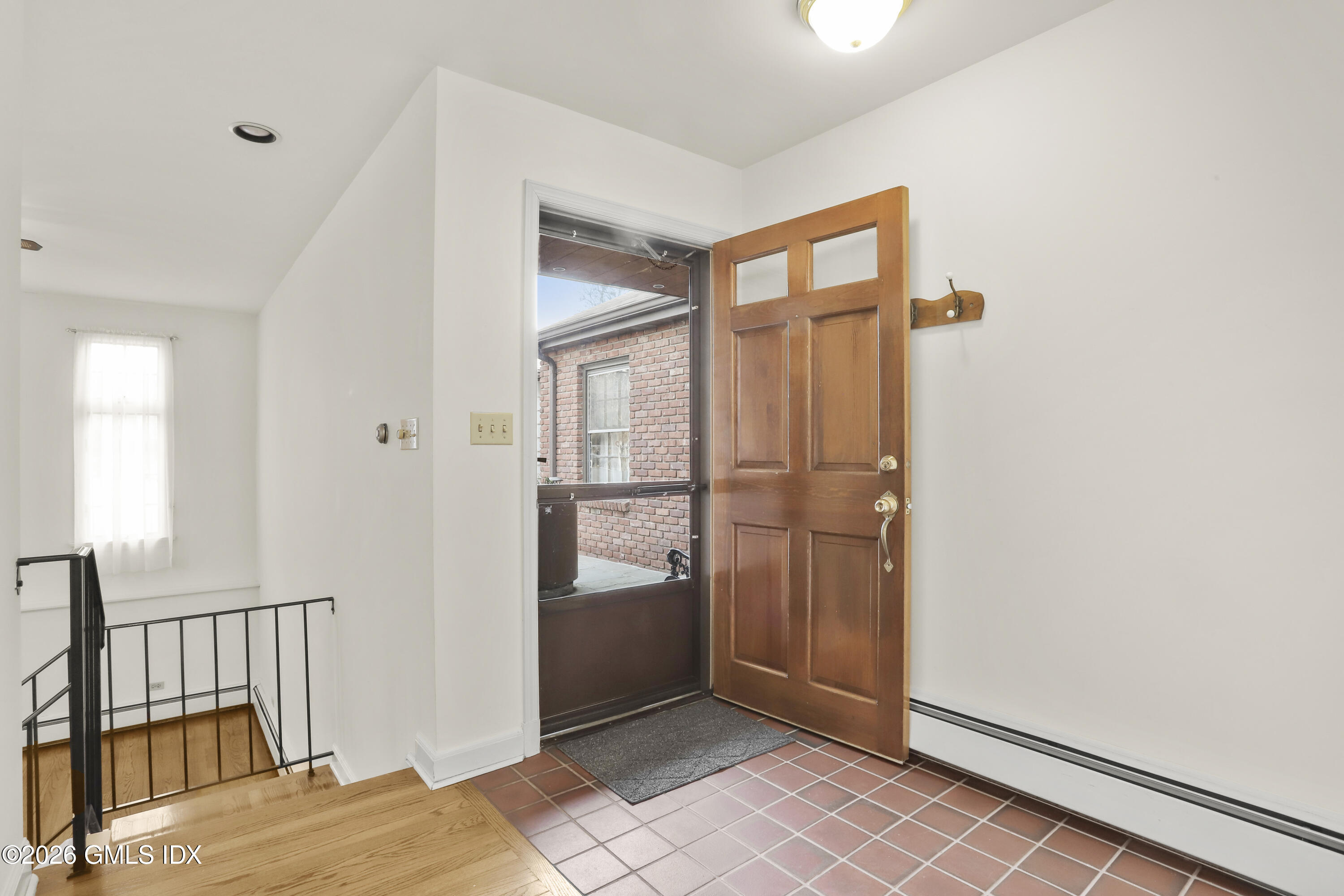 200 Weaver Street, Unit B Greenwich, CT 06831 - Photo 4 of 30 a view of a hallway with wooden floor and entryway