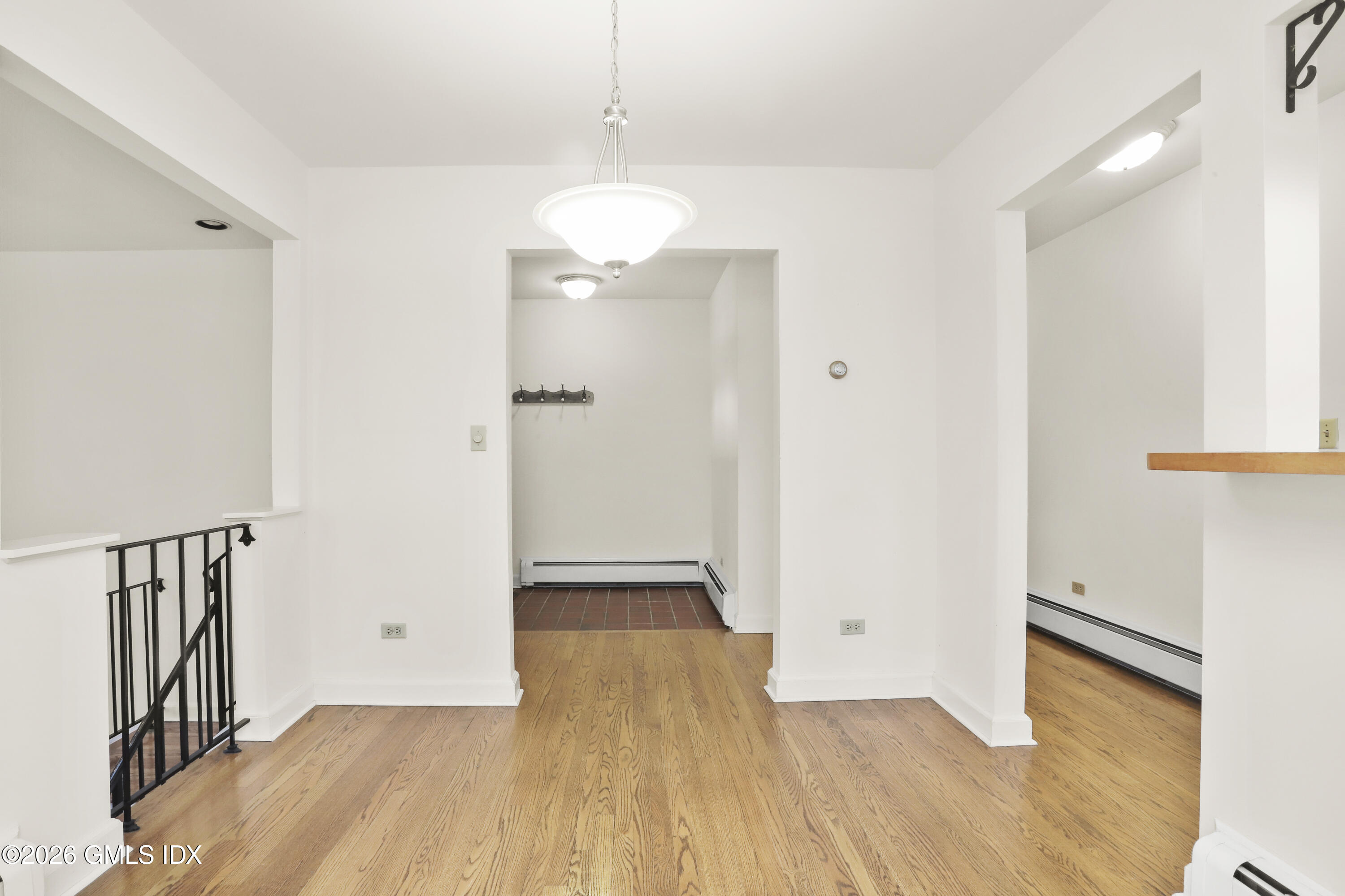 200 Weaver Street, Unit B Greenwich, CT 06831 - Photo 5 of 30 an empty room with wooden floor and windows