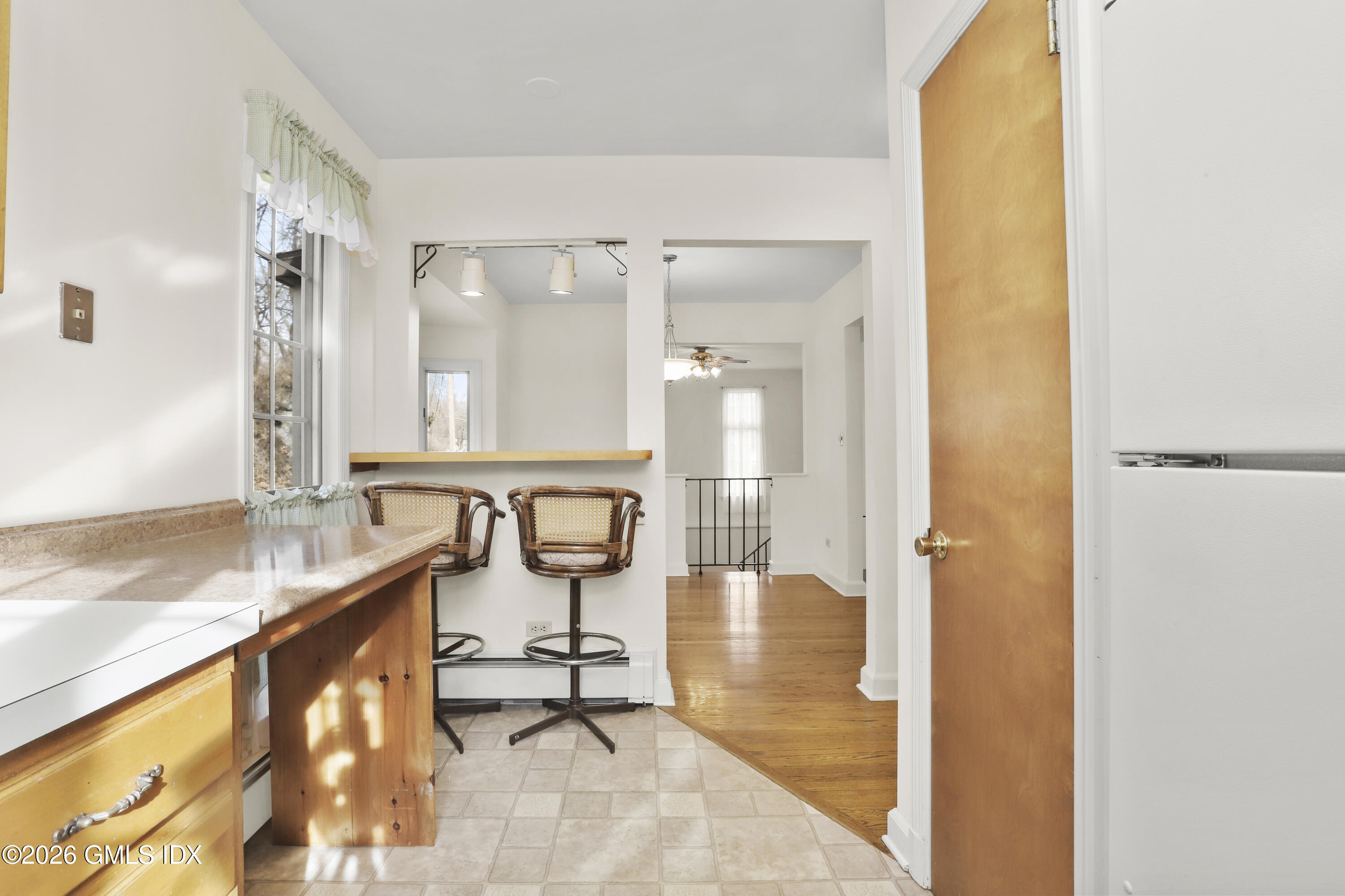 200 Weaver Street, Unit B Greenwich, CT 06831 - Photo 9 of 30 a bathroom with a granite countertop sink and a mirror