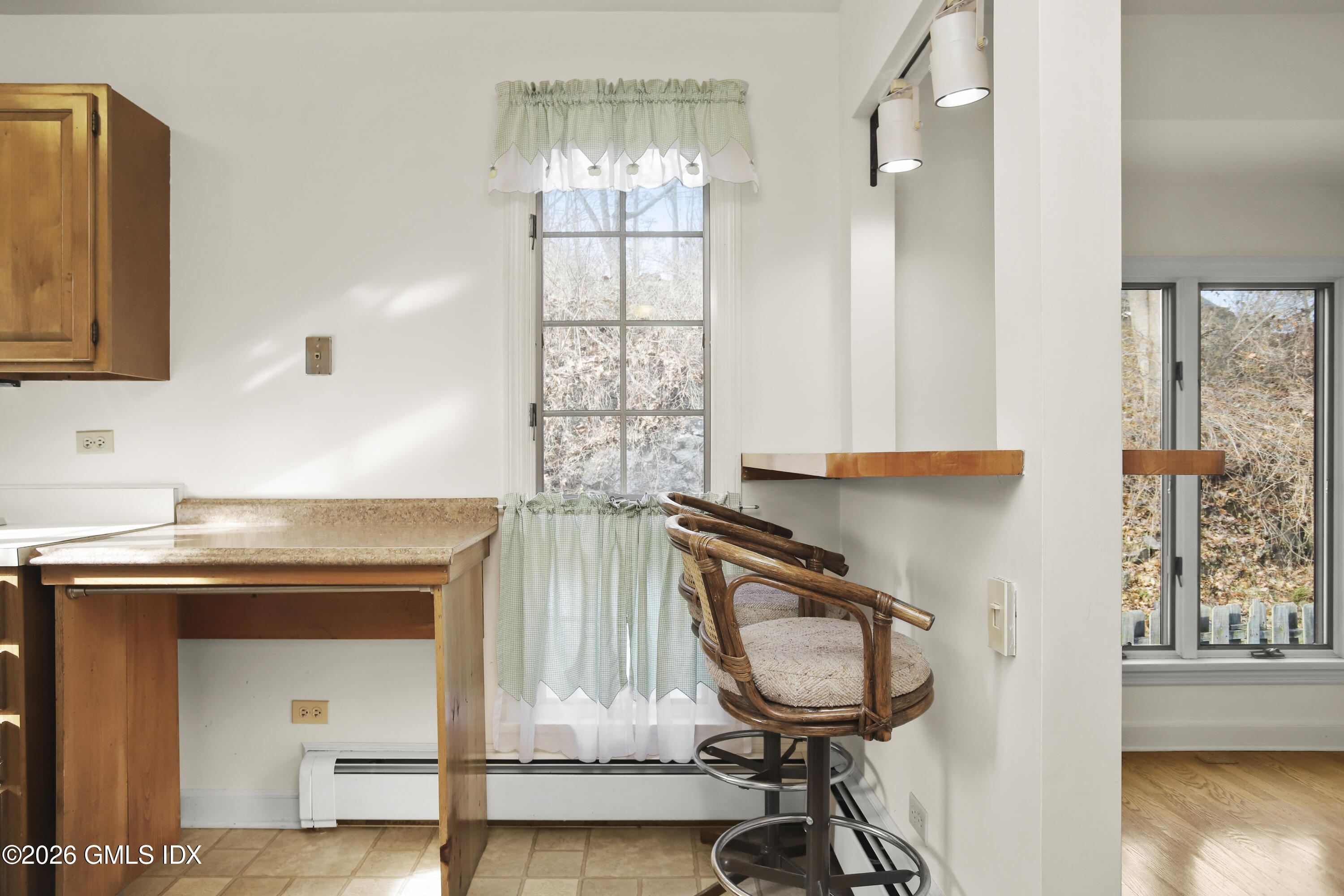 200 Weaver Street, Unit B Greenwich, CT 06831 - Photo 10 of 30 a bathroom with a sink a mirror and a window