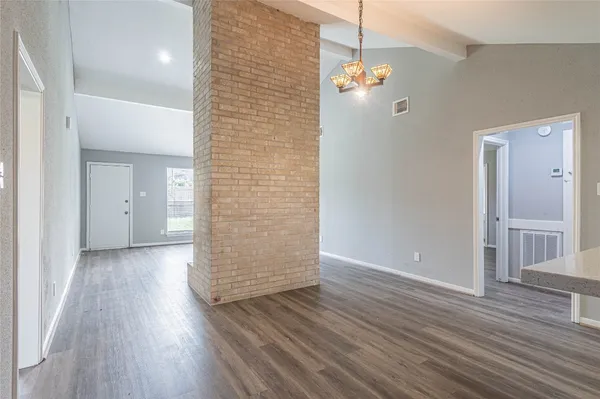 a view of a livingroom with wooden floor