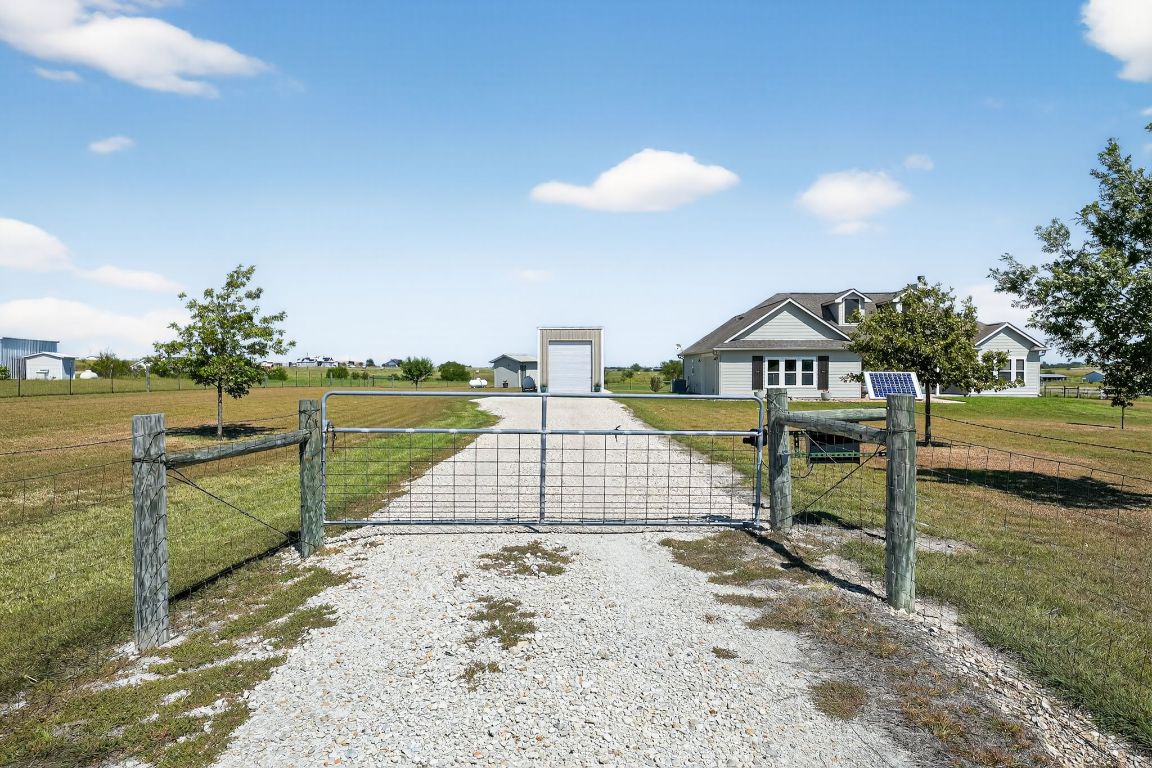 813 Cr 342 Road Granger, TX 76530 - Photo 2 of 32 a view of swimming pool with seating space and yard