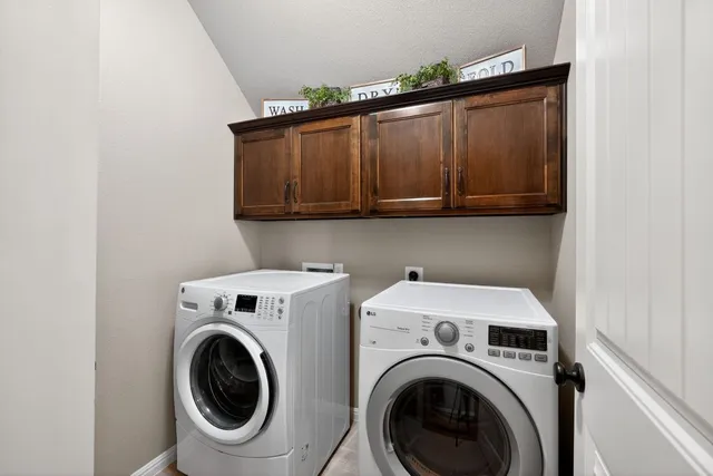 a utility room with dryer and washer