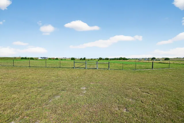a view of a golf course with a lake