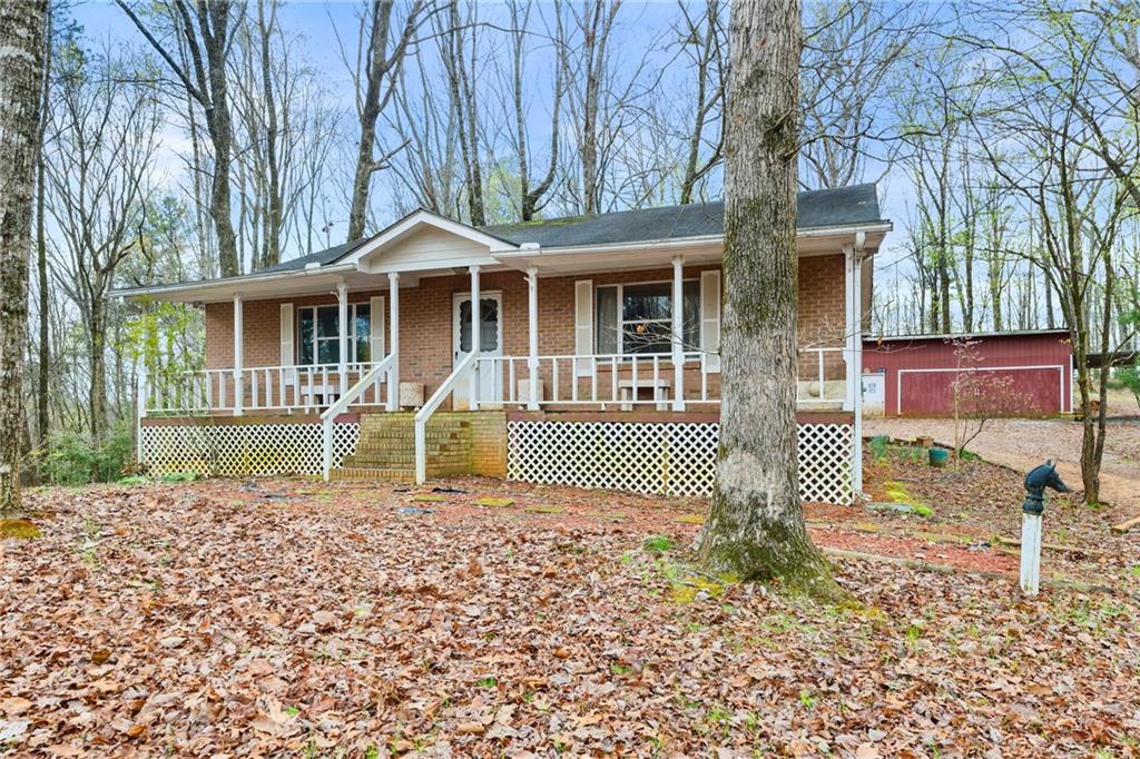 2531 Dean Mountain Road Cleveland, GA 30528 - Photo 1 of 1 a front view of a house with a yard