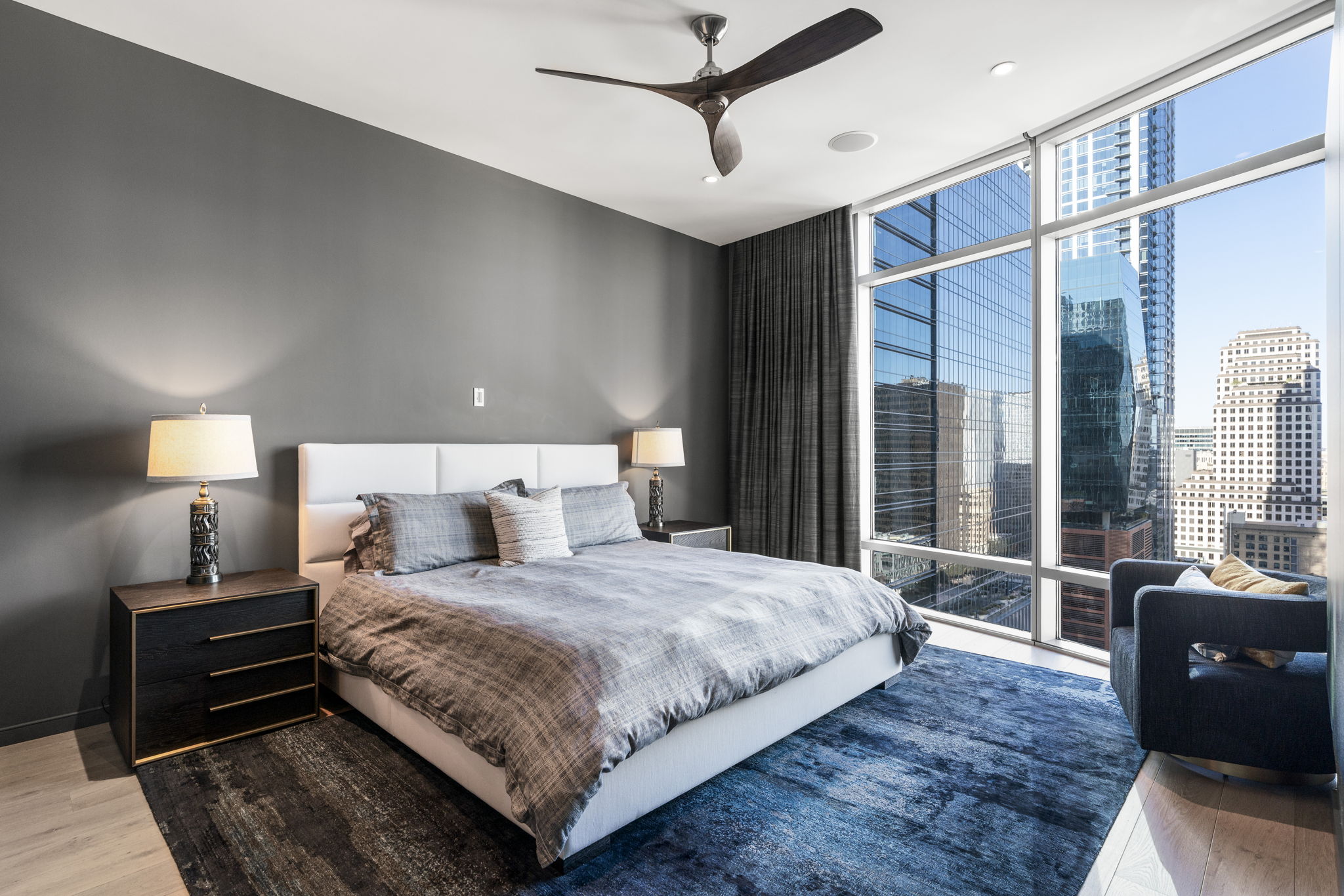 200 Congress Avenue, Unit 21D Austin, TX 78701 - Photo 17 of 34 Primary bedroom with city views and a custom made blackout curtiain
