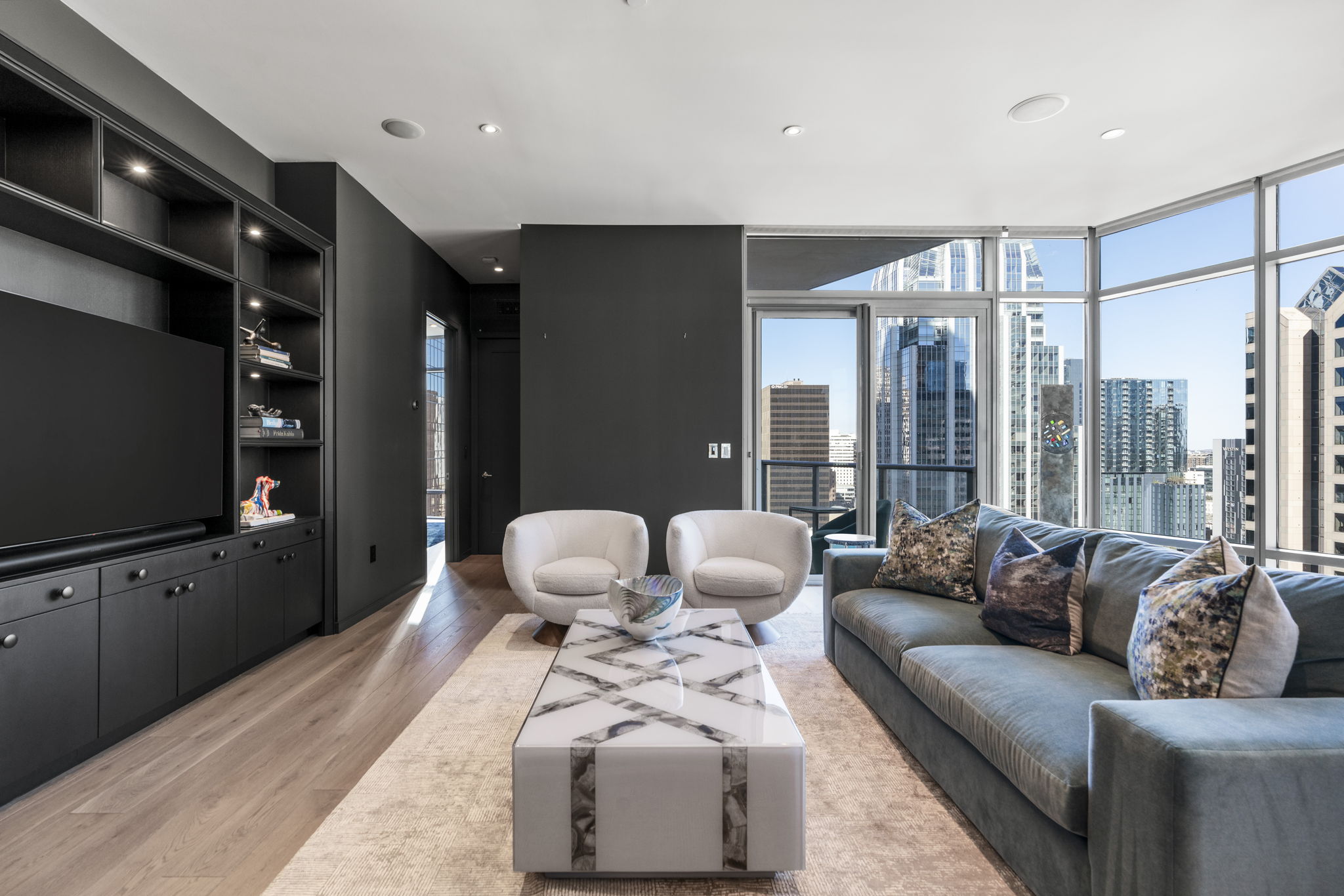 200 Congress Avenue, Unit 21D Austin, TX 78701 - Photo 6 of 34 Living area with expansive windows and amazing city views