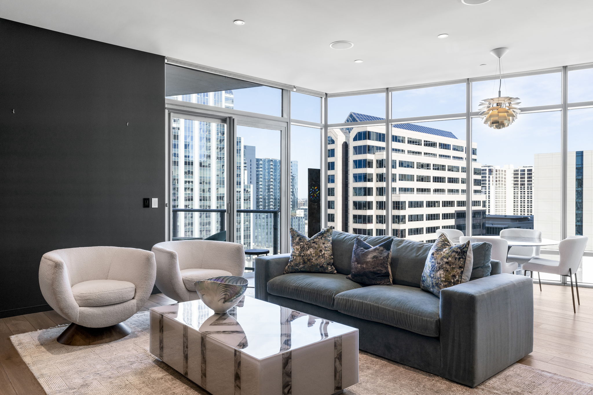 200 Congress Avenue, Unit 21D Austin, TX 78701 - Photo 7 of 34 Living area with floor to ceiling windows