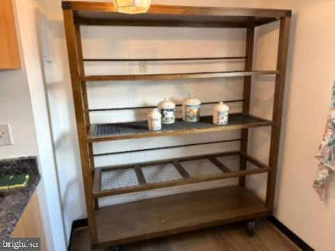 a shelf with cup and plates