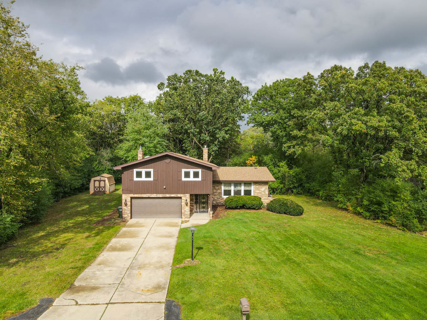 839 Highview Avenue Olympia Fields, IL 60461 - Photo 3 of 30 a view of a big yard with plants and large trees