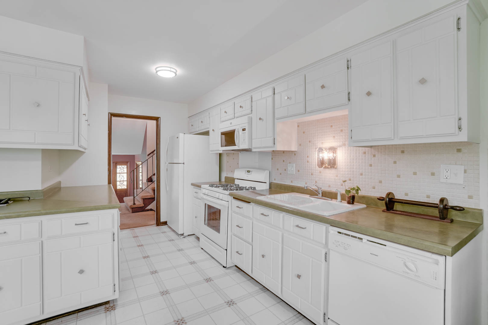 839 Highview Avenue Olympia Fields, IL 60461 - Photo 9 of 30 a kitchen with white cabinets appliances and sink