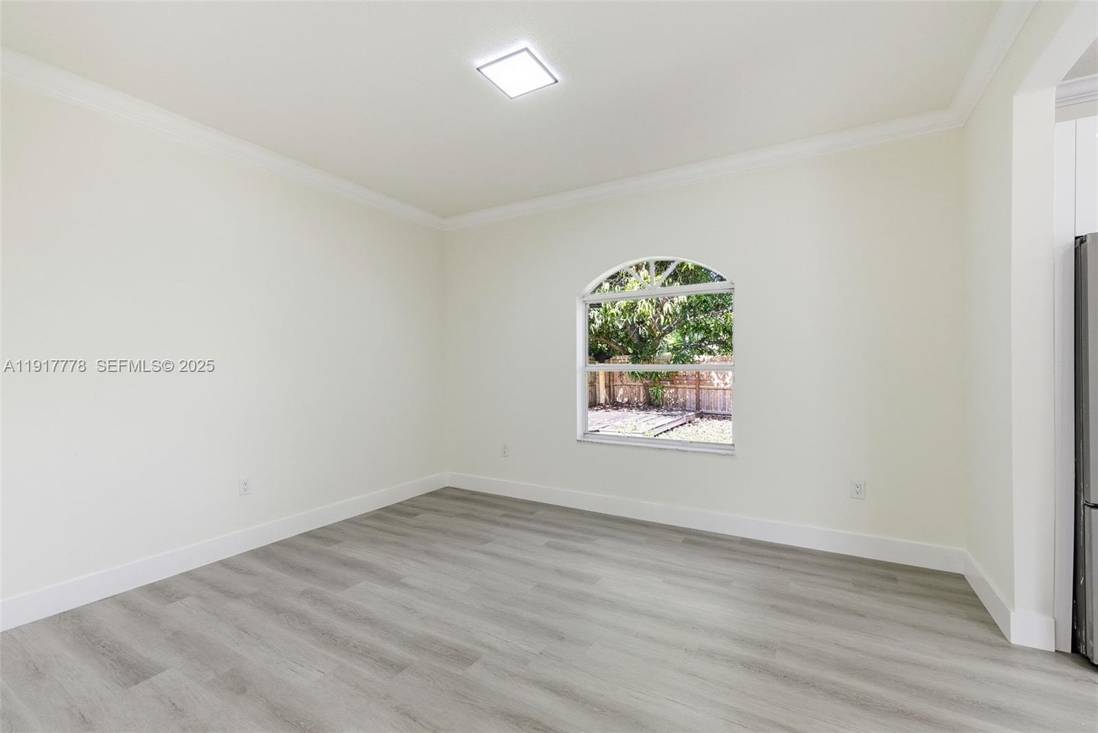 19601 Southwest 128th Court Miami, FL 33177 - Photo 13 of 59 an empty room with a window
