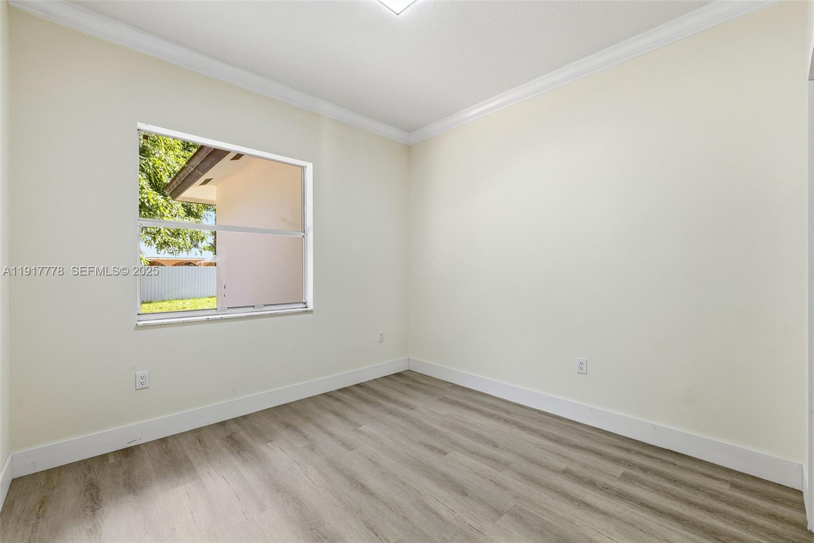 19601 Southwest 128th Court Miami, FL 33177 - Photo 20 of 59 an empty room with a window