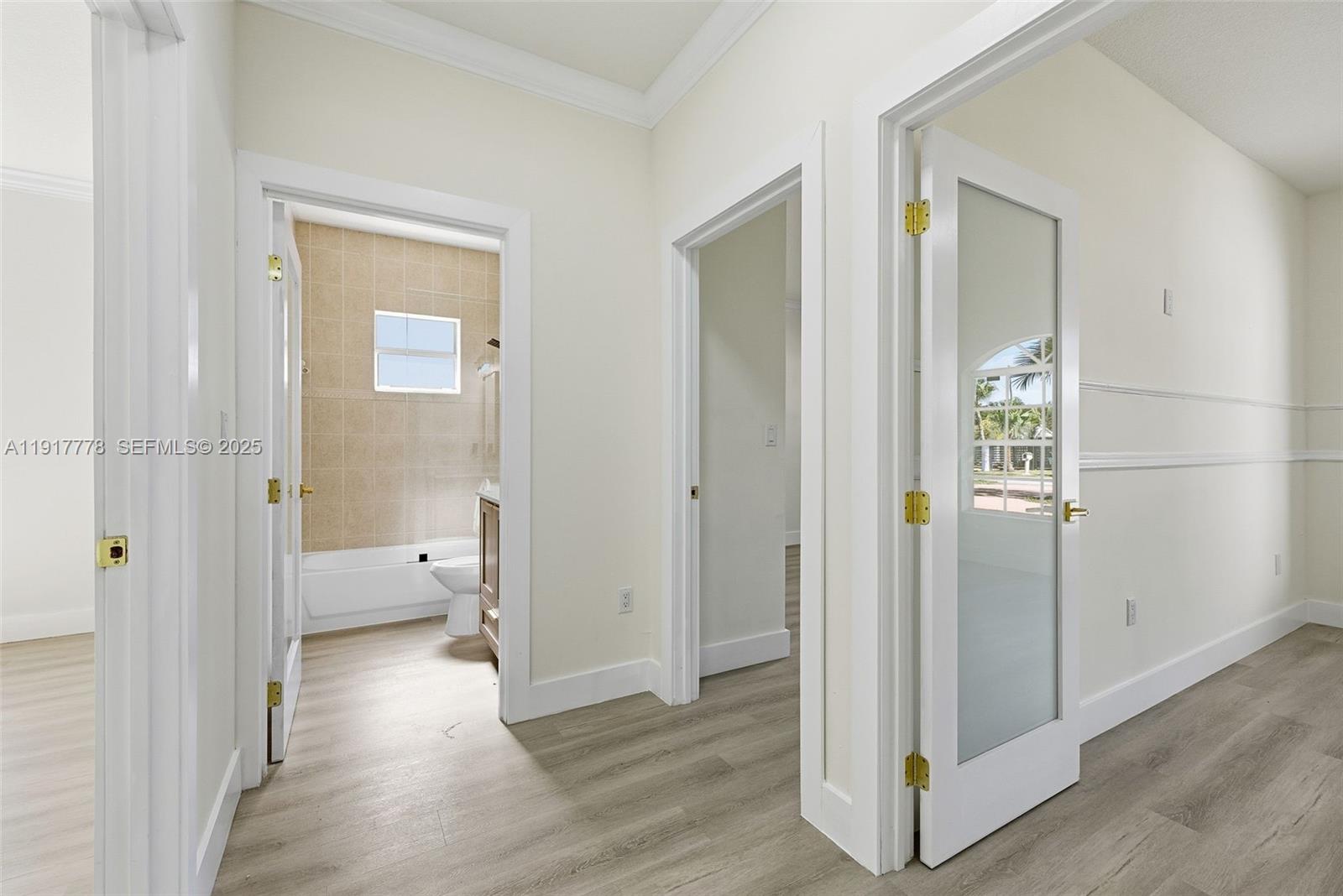 19601 Southwest 128th Court Miami, FL 33177 - Photo 21 of 59 a view of a hallway with wooden floor and closet area