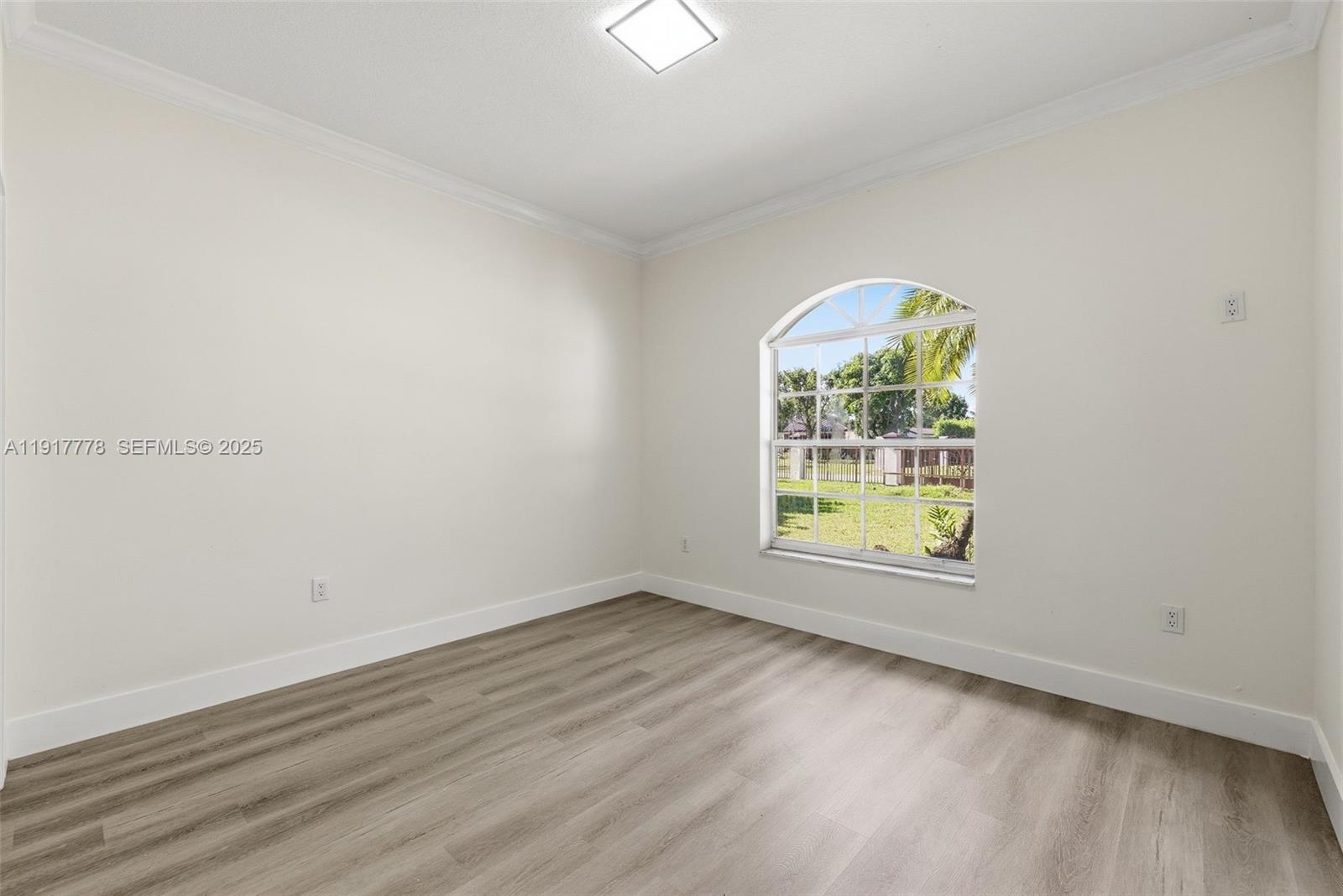 19601 Southwest 128th Court Miami, FL 33177 - Photo 23 of 59 an empty room with a window