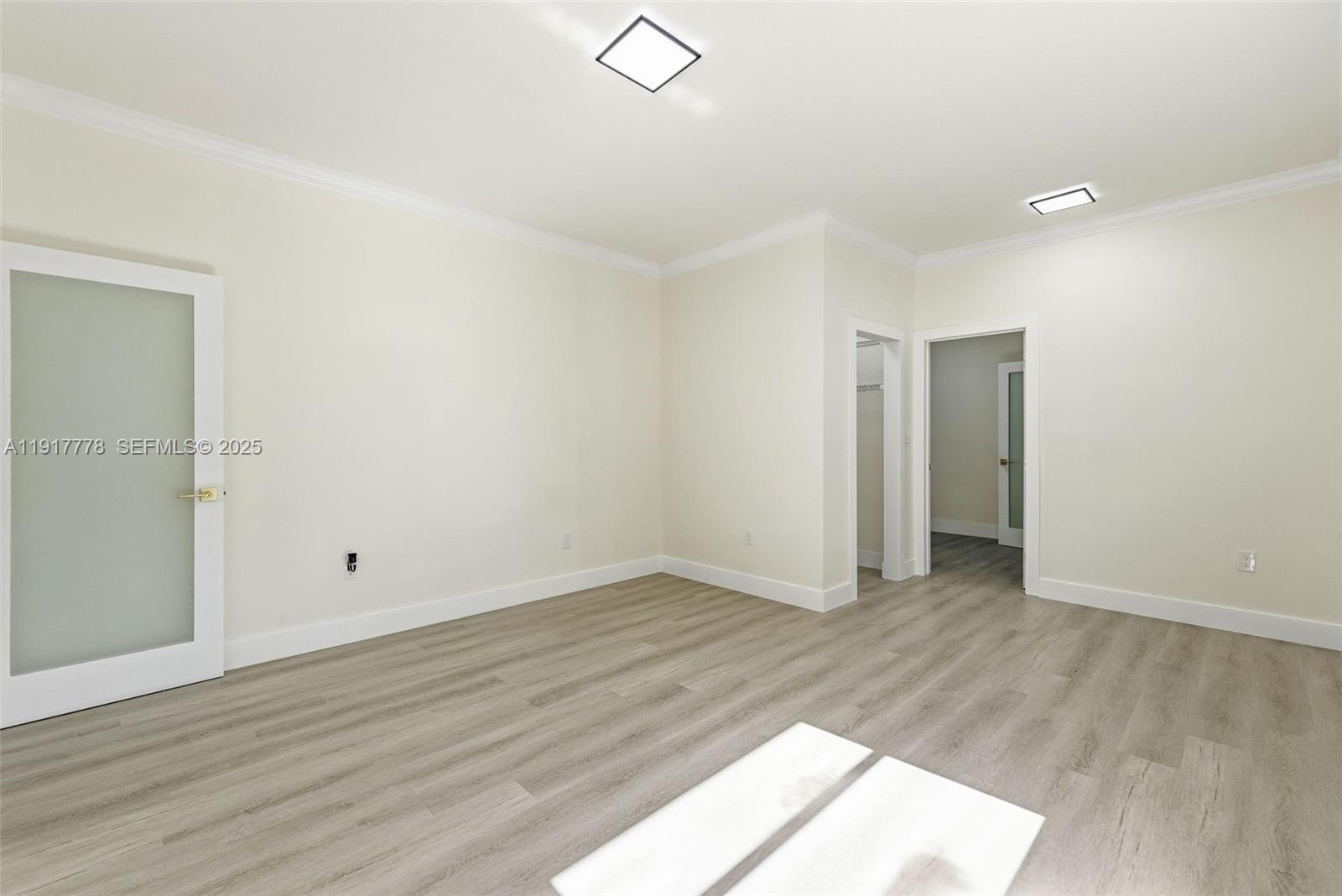 19601 Southwest 128th Court Miami, FL 33177 - Photo 26 of 59 an empty room with wooden floor