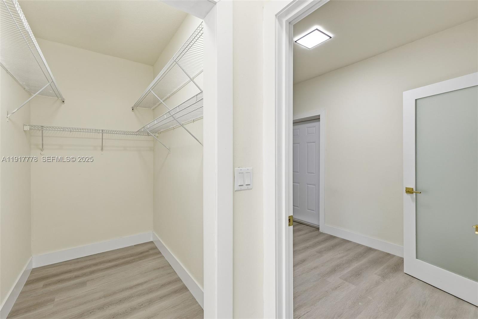 19601 Southwest 128th Court Miami, FL 33177 - Photo 28 of 59 a view of a hallway with wooden floor