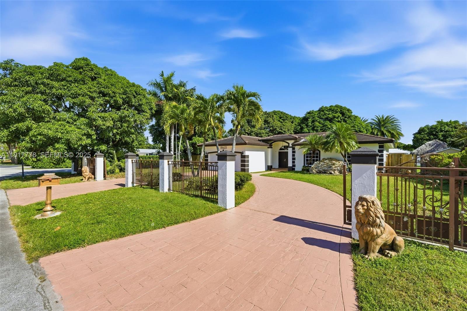 19601 Southwest 128th Court Miami, FL 33177 - Photo 3 of 59 a view of a house with a swimming pool