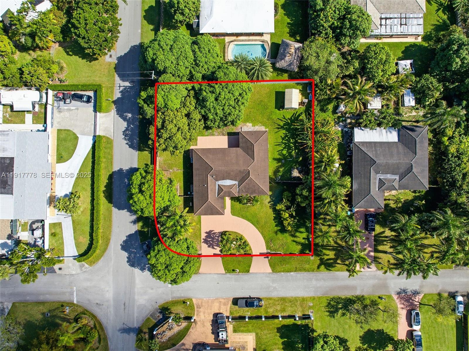 19601 Southwest 128th Court Miami, FL 33177 - Photo 42 of 59 an aerial view of a house with a yard and garden