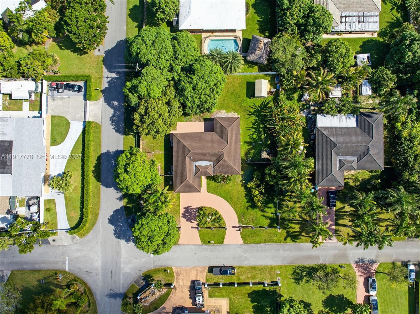 19601 Southwest 128th Court Miami, FL 33177 - Photo 43 of 59 an aerial view of a house with a yard and garden