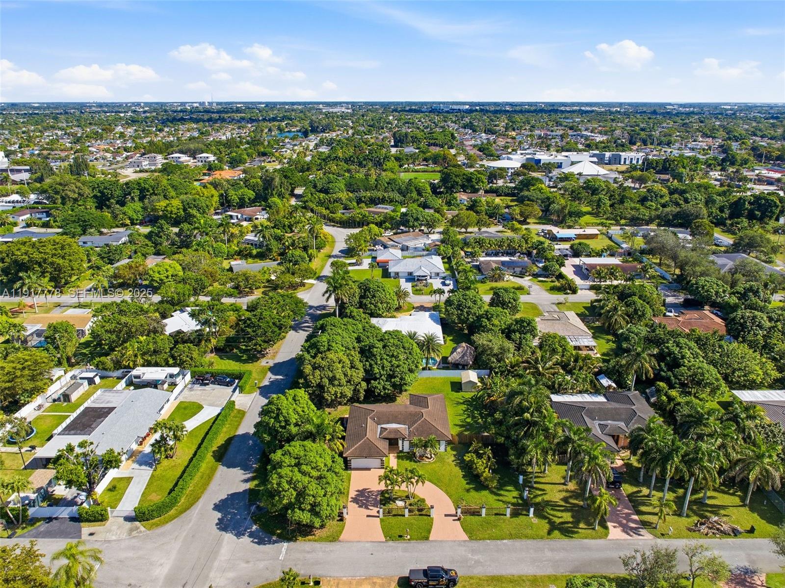 19601 Southwest 128th Court Miami, FL 33177 - Photo 45 of 59 an aerial view of residential houses with outdoor space and trees
