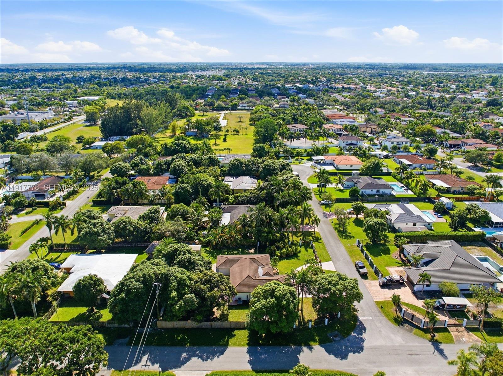 19601 Southwest 128th Court Miami, FL 33177 - Photo 49 of 59 an aerial view of a city with lots of residential buildings