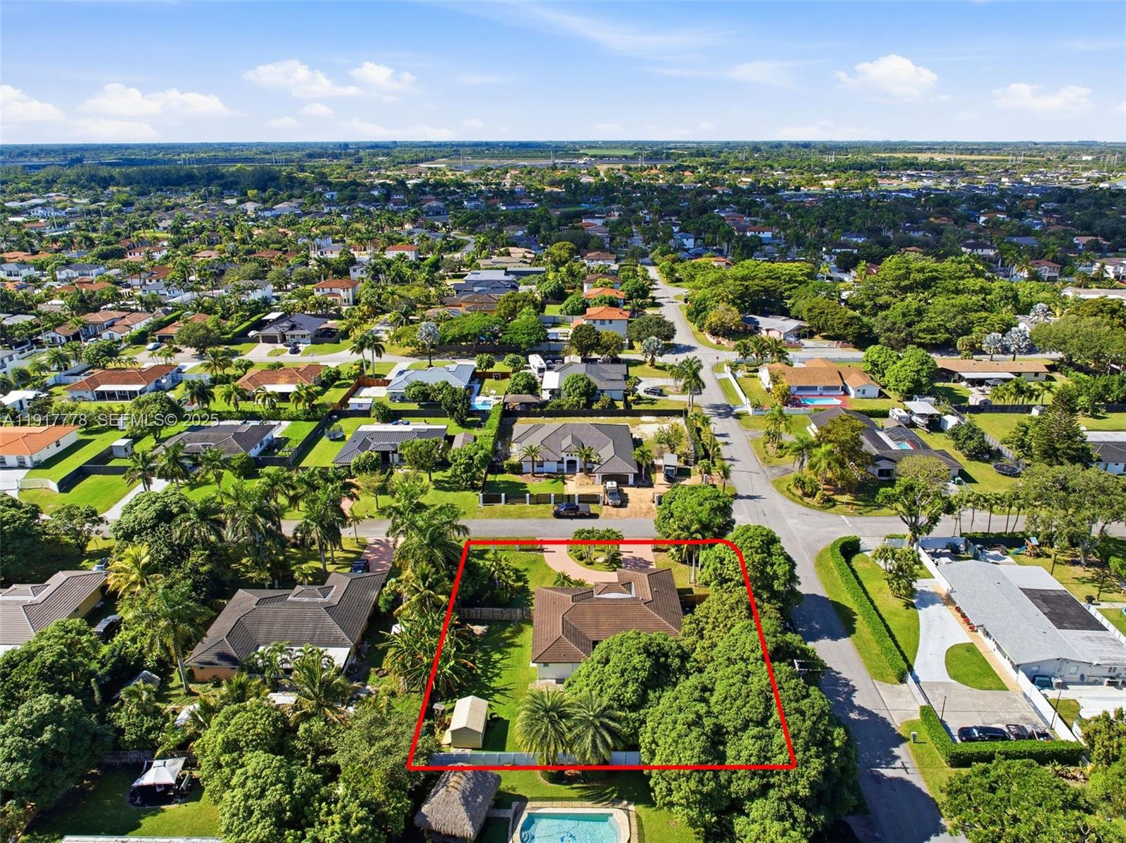19601 Southwest 128th Court Miami, FL 33177 - Photo 52 of 59 an aerial view of residential houses with outdoor space and trees