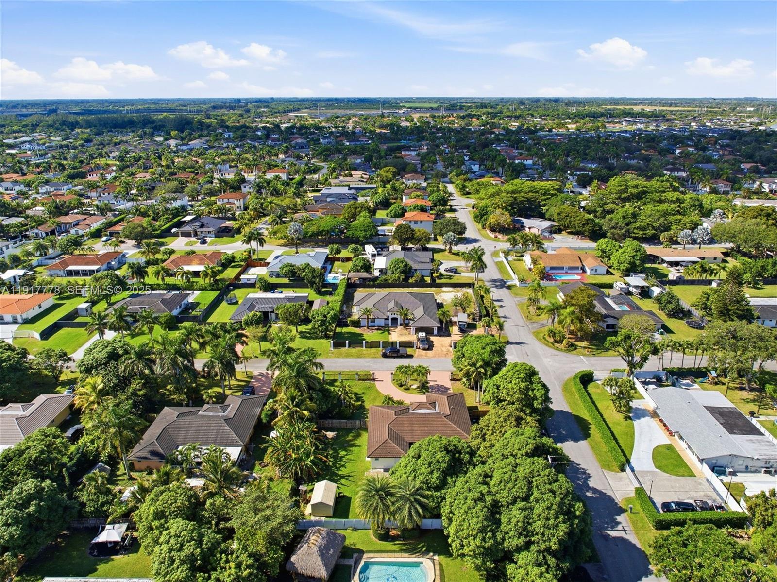 19601 Southwest 128th Court Miami, FL 33177 - Photo 53 of 59 an aerial view of residential houses with outdoor space and trees