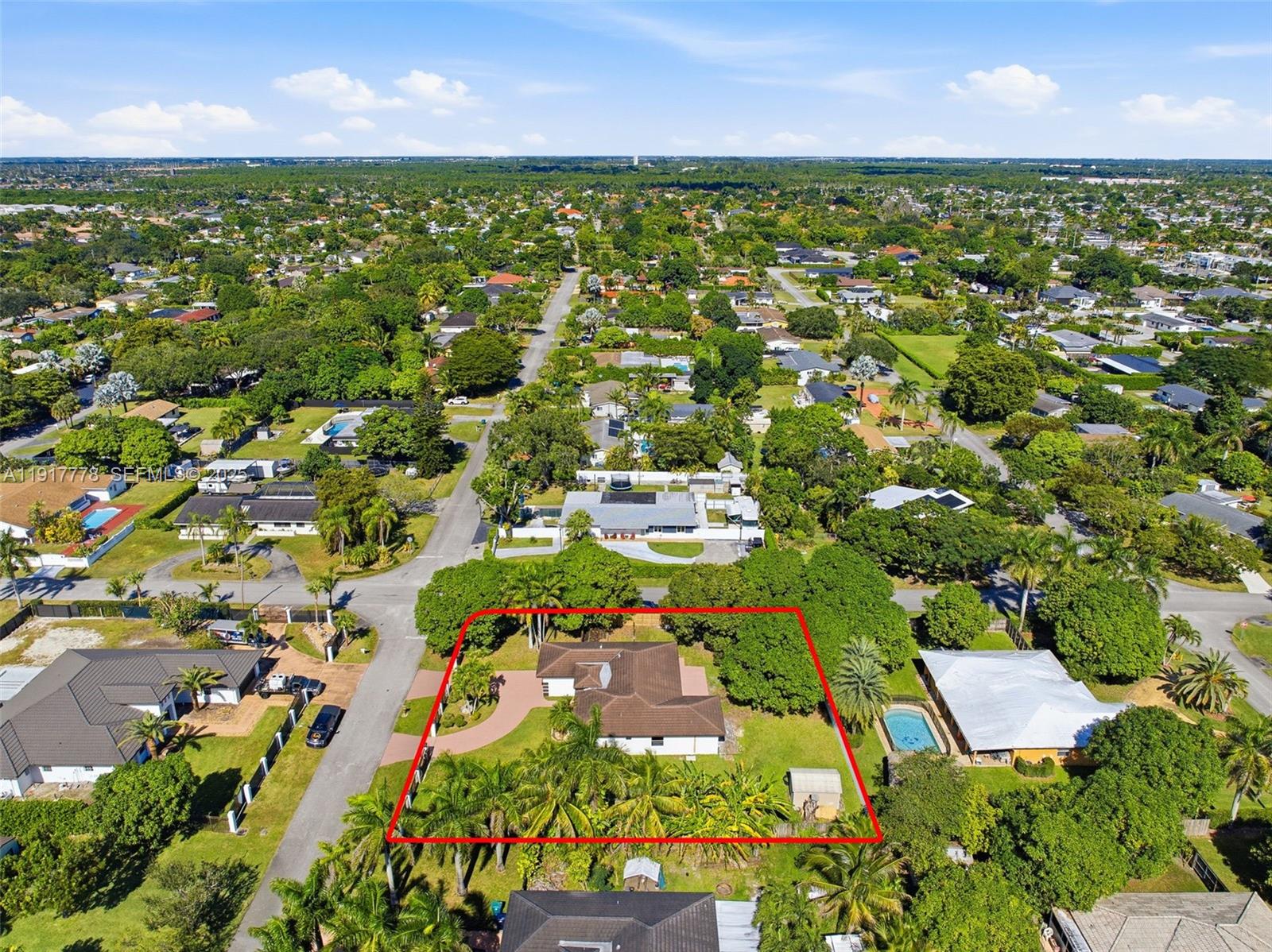 19601 Southwest 128th Court Miami, FL 33177 - Photo 56 of 59 an aerial view of residential houses with outdoor space and trees