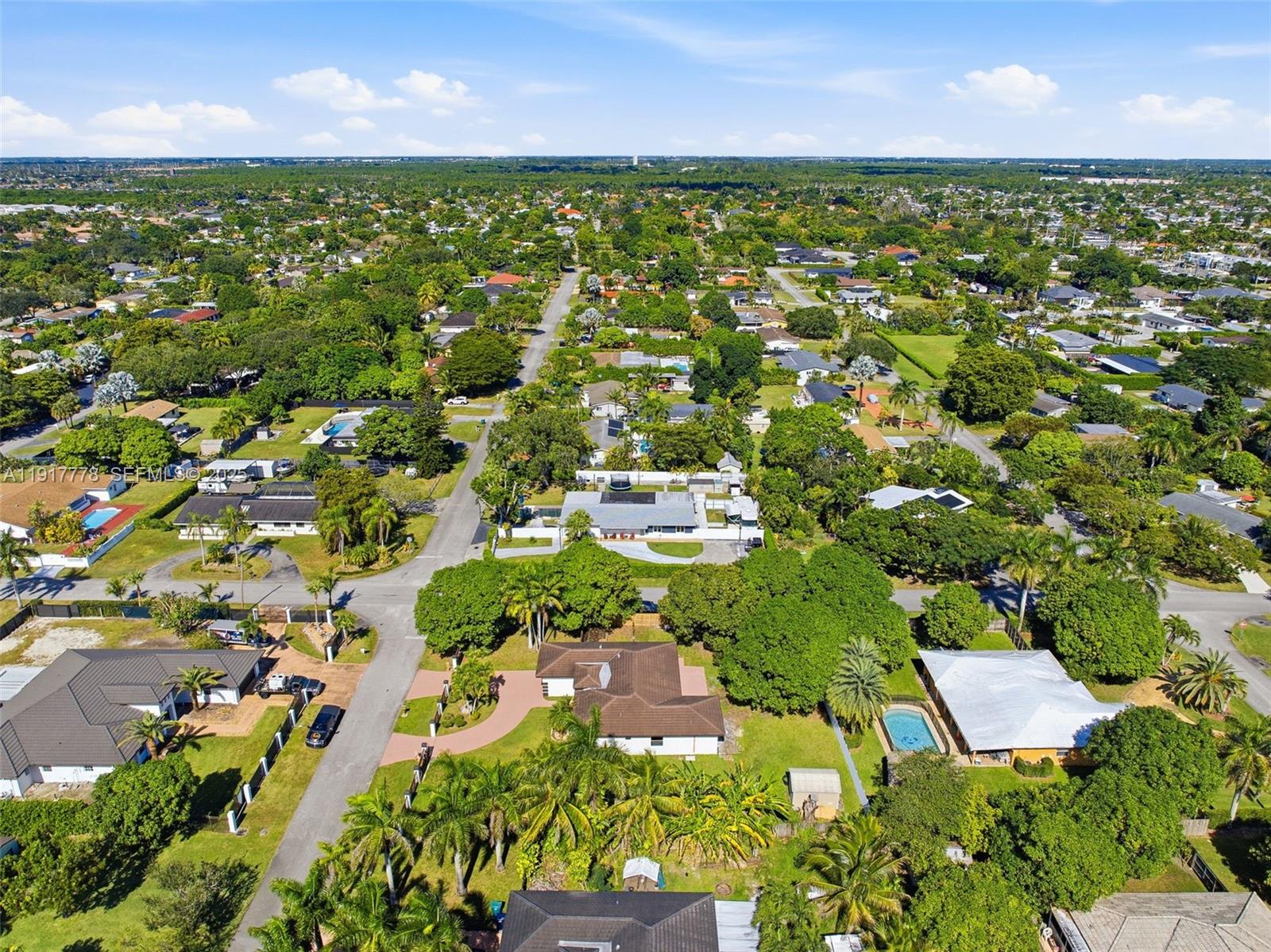 19601 Southwest 128th Court Miami, FL 33177 - Photo 57 of 59 an aerial view of residential houses with outdoor space and trees