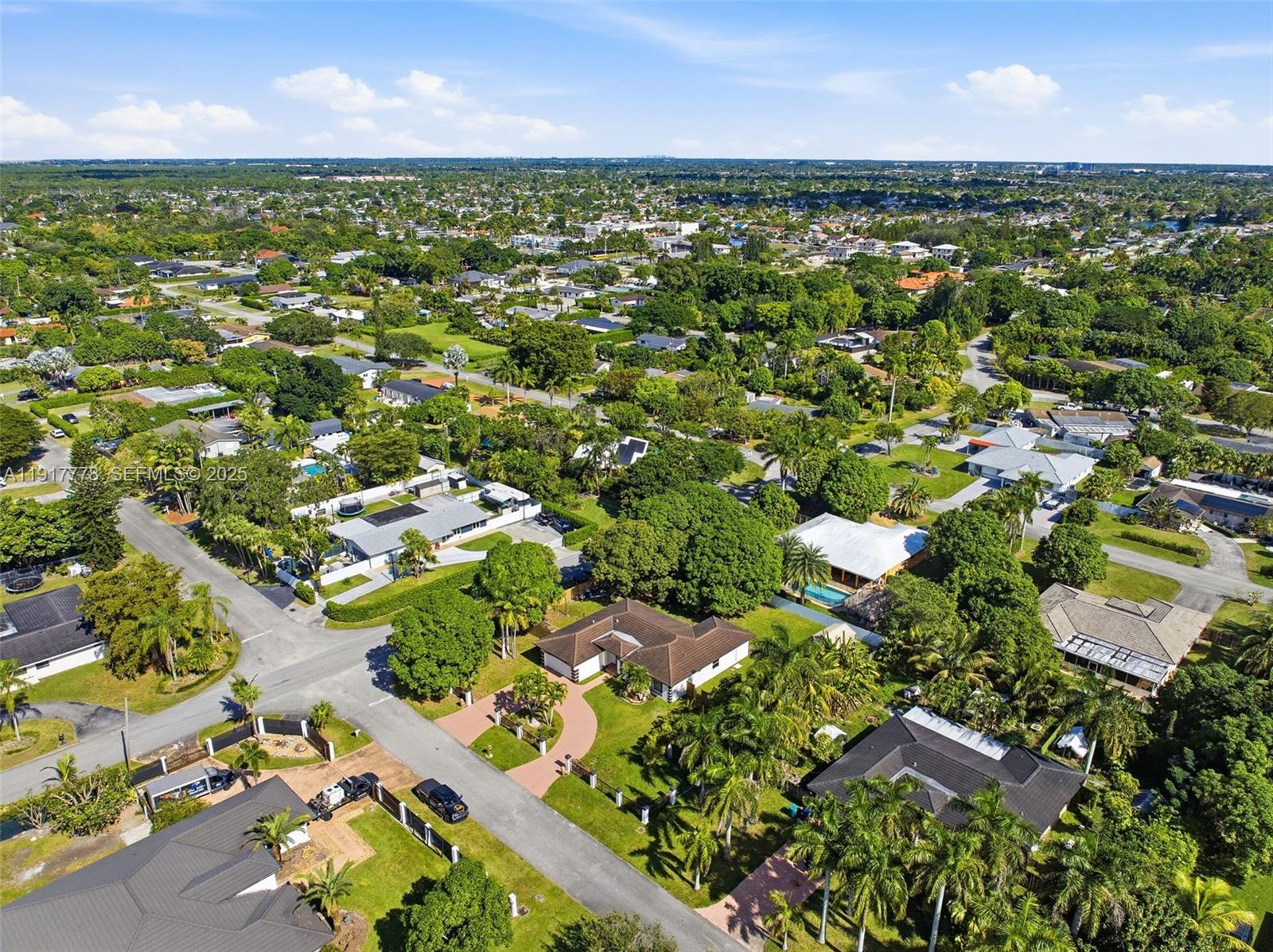 19601 Southwest 128th Court Miami, FL 33177 - Photo 59 of 59 an aerial view of residential houses with outdoor space and trees
